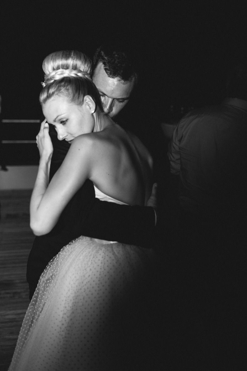 Artistic black and white photograph of dancers in an intimate moment.