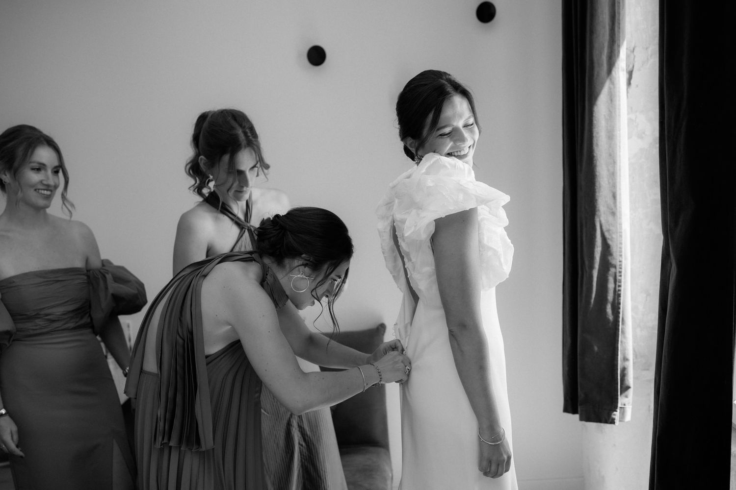 Blurred black and white candid moments during wedding preparations.