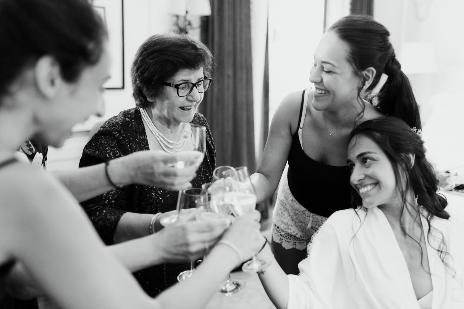 Candid black and white moments captured during wedding preparations.