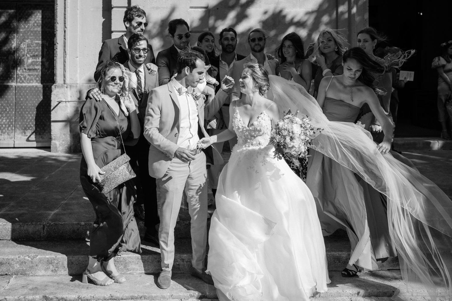 Black and white wedding photography sequence capturing candid moments during the ceremony.