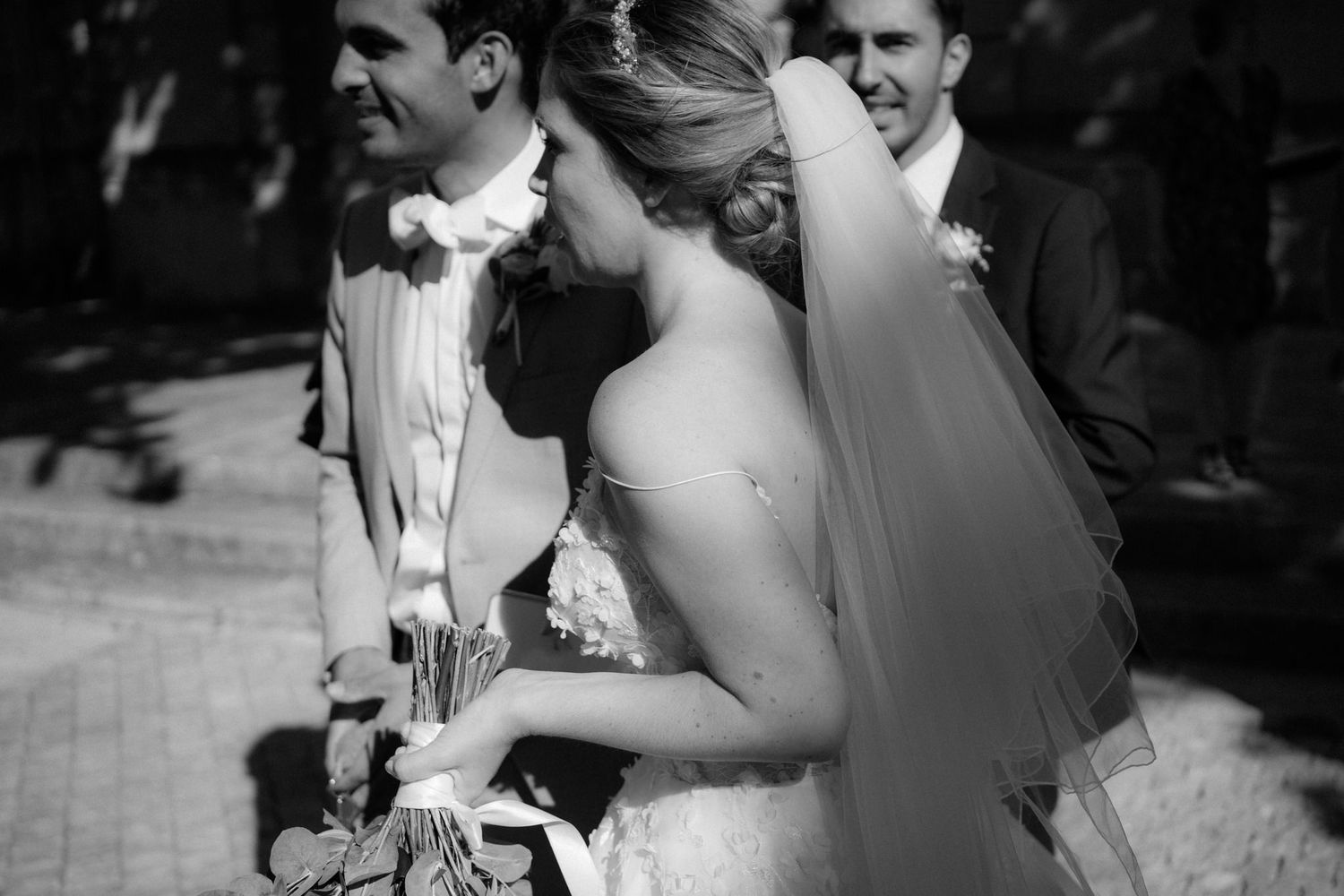 An intimate black and white wedding moment captured in natural light.