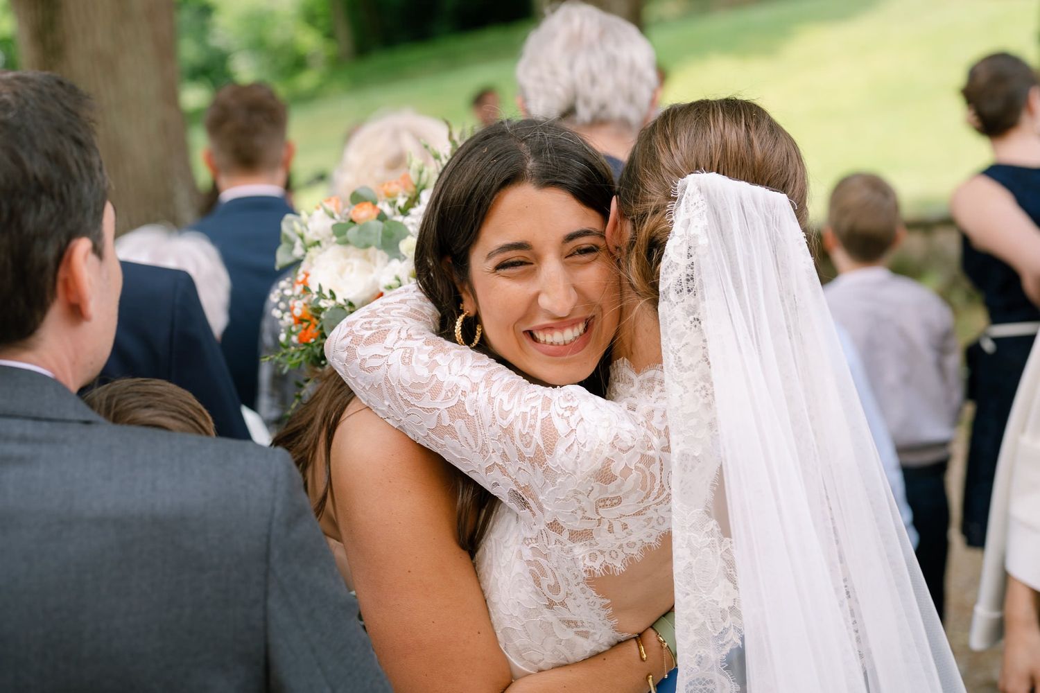 Joyful wedding celebration moments captured outdoors in natural lighting.