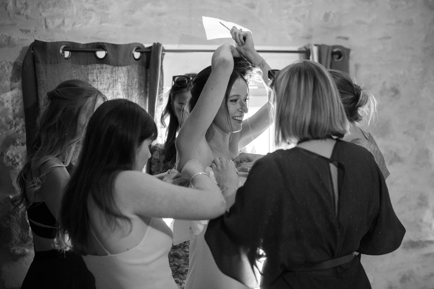 Black and white candid shots of wedding preparations and getting ready moments.