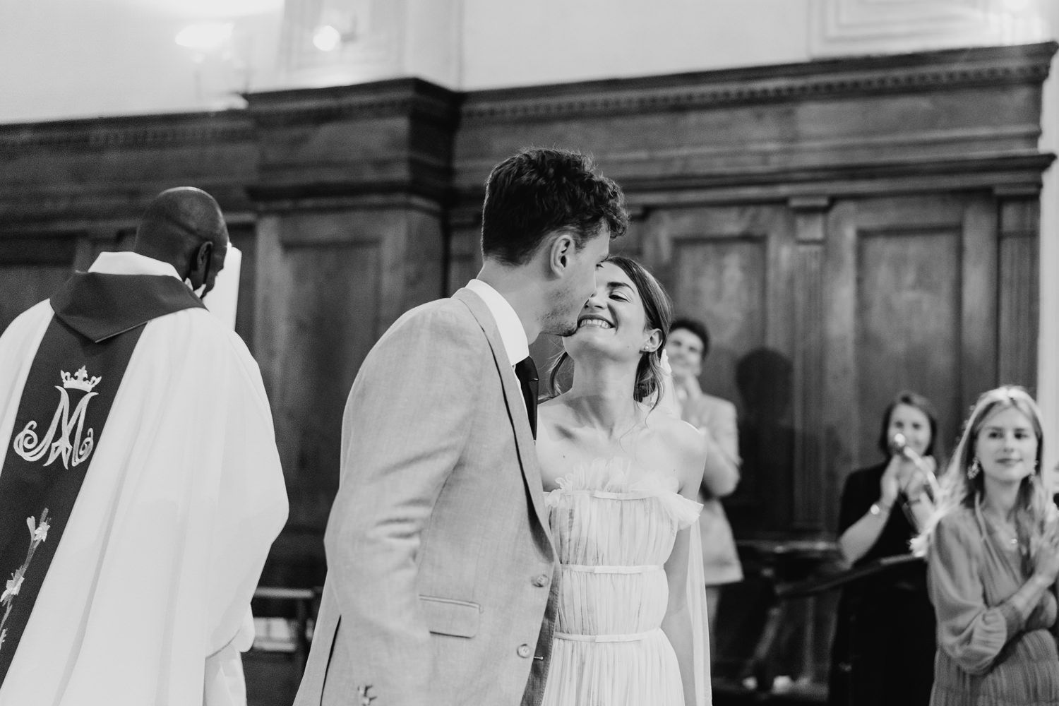 An intimate moment captured during a traditional church wedding ceremony.
