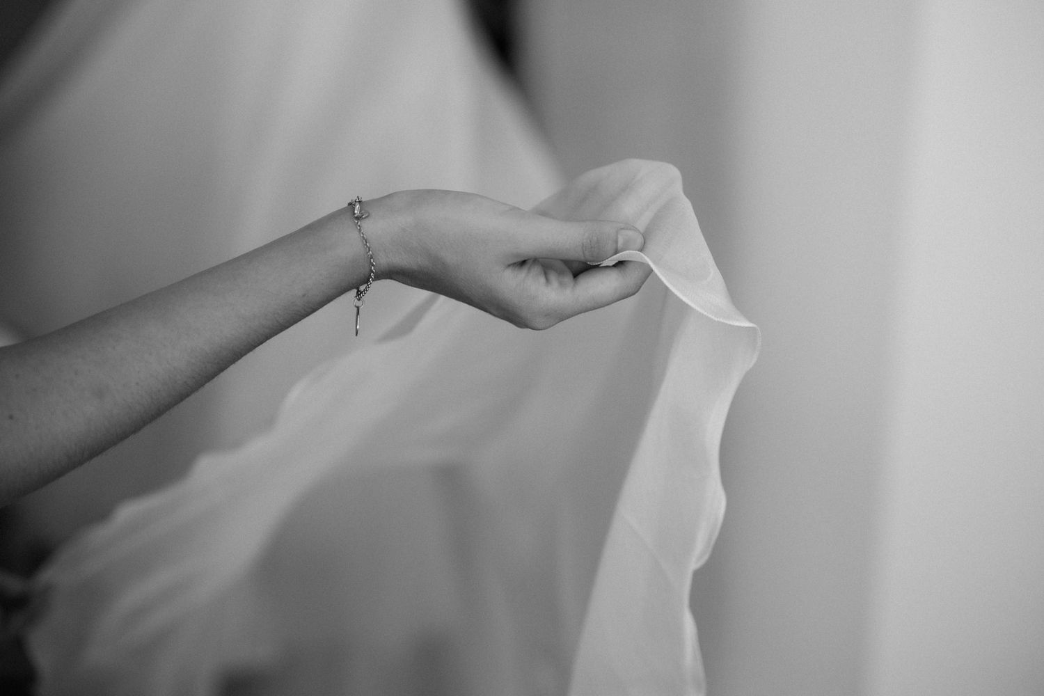Close-up detail of white fabric in soft natural lighting.