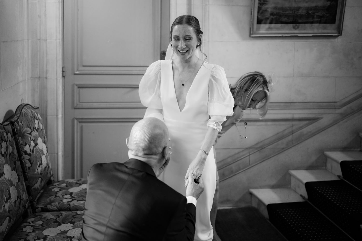 Black and white photograph showing preparations inside a church before a wedding ceremony.