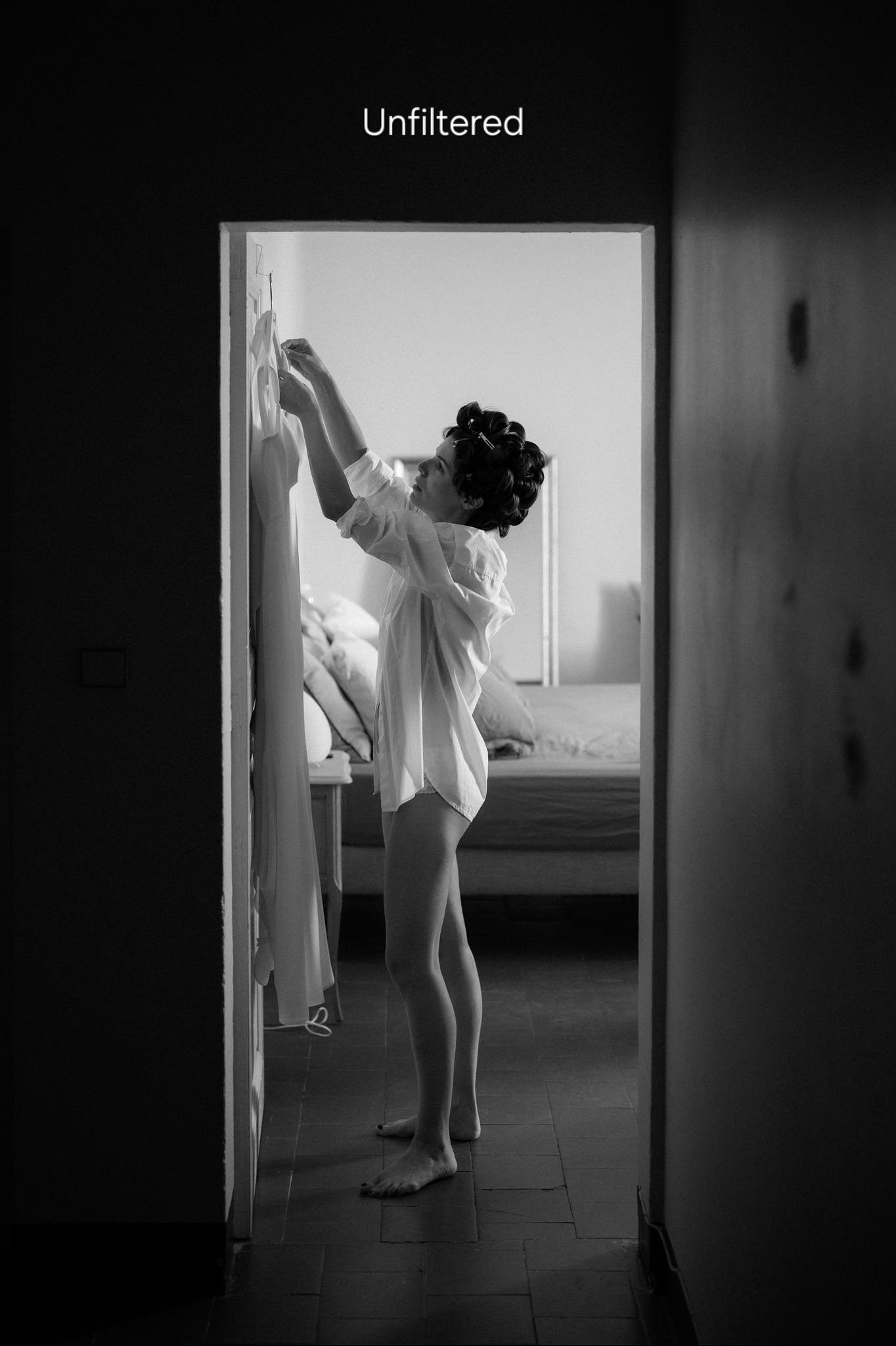 Artistic black and white silhouettes of someone in white clothing moving through doorways and hallways.