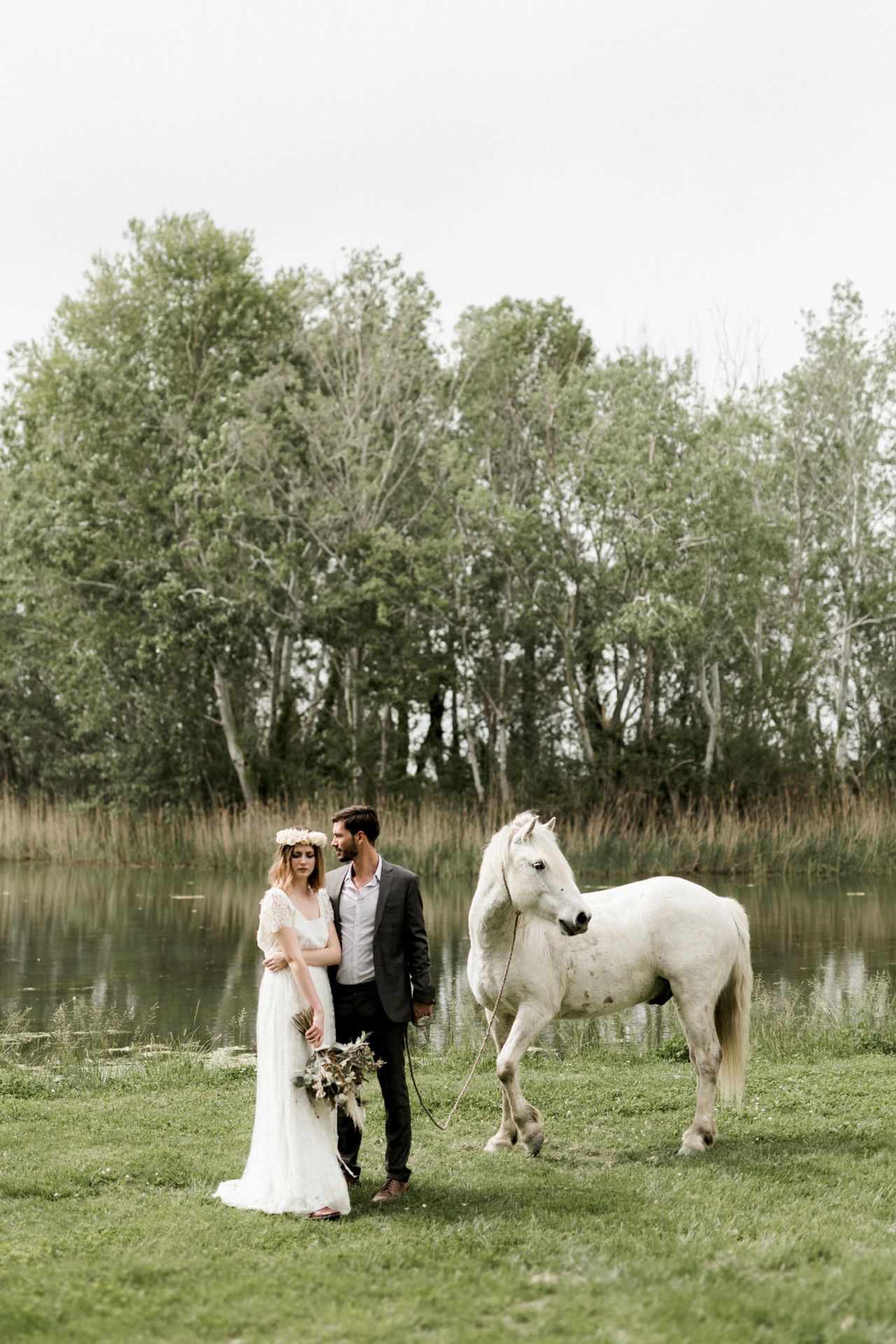 Wedding photo sequence with a white horse in a pastoral setting with trees.