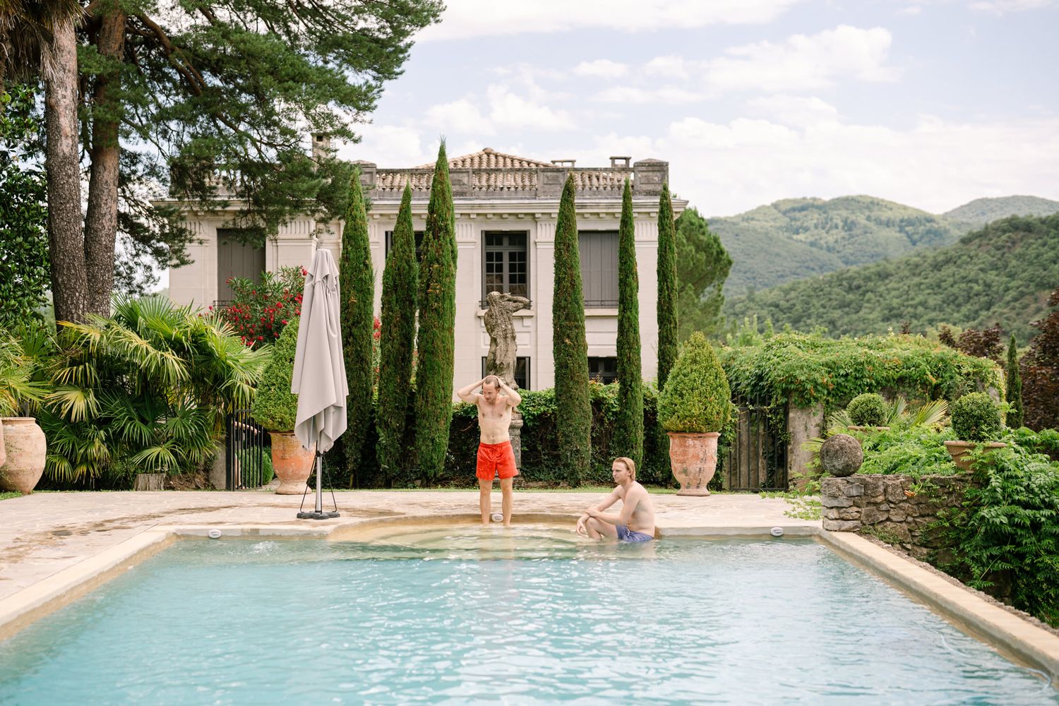 Luxurious infinity pool overlooking mountain landscape at an elegant estate.