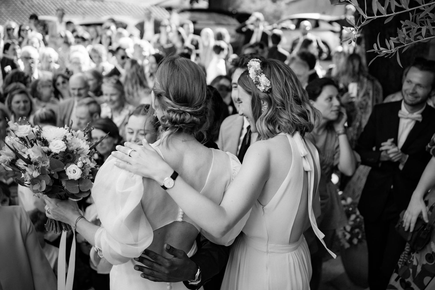 Black and white photos of wedding reception celebration with dancing guests.