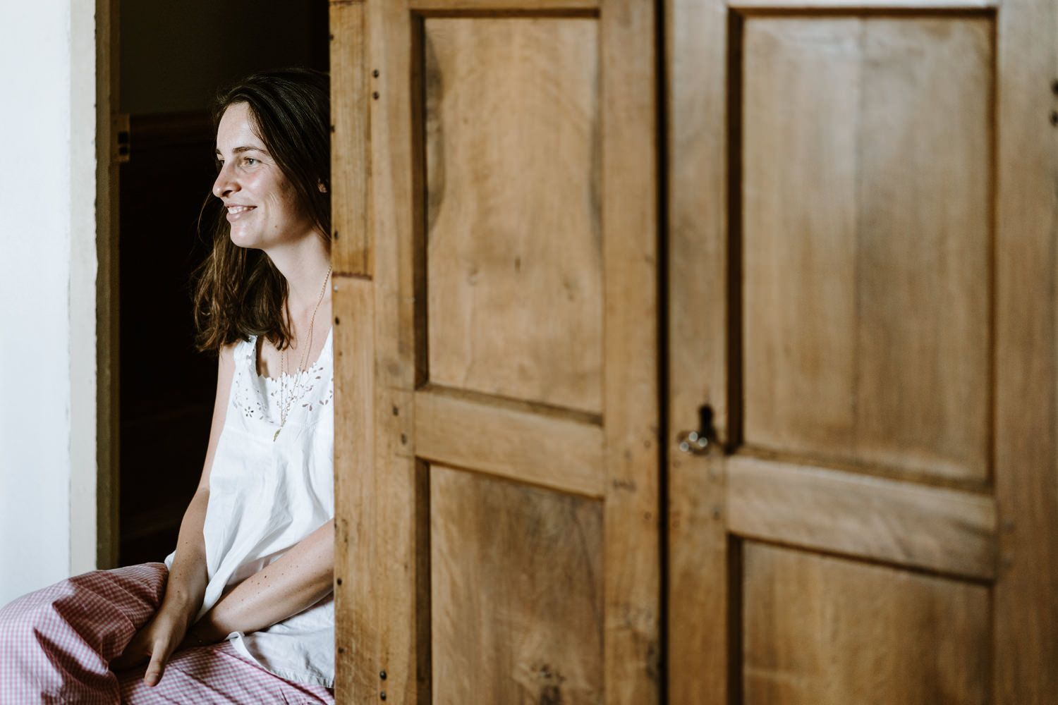 Wooden paneled walls and doors in a rustic interior setting.
