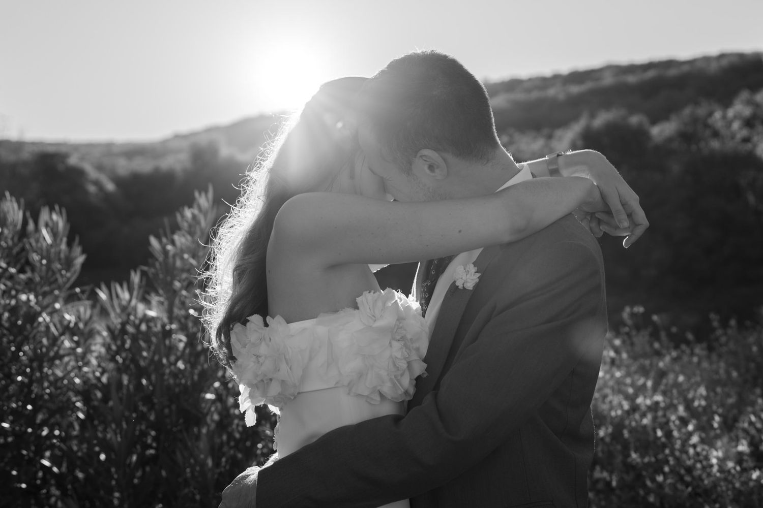 Black and white wedding portraits with dramatic backlighting and silhouettes.