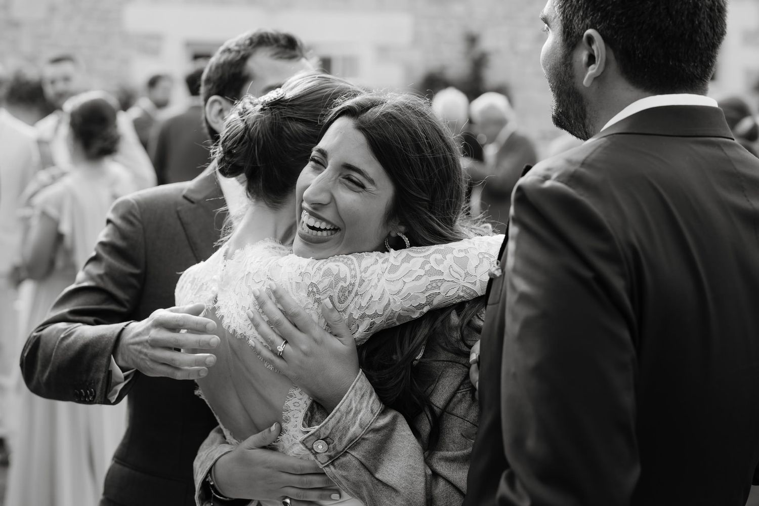 Black and white candid shots capturing joyful wedding celebration moments.