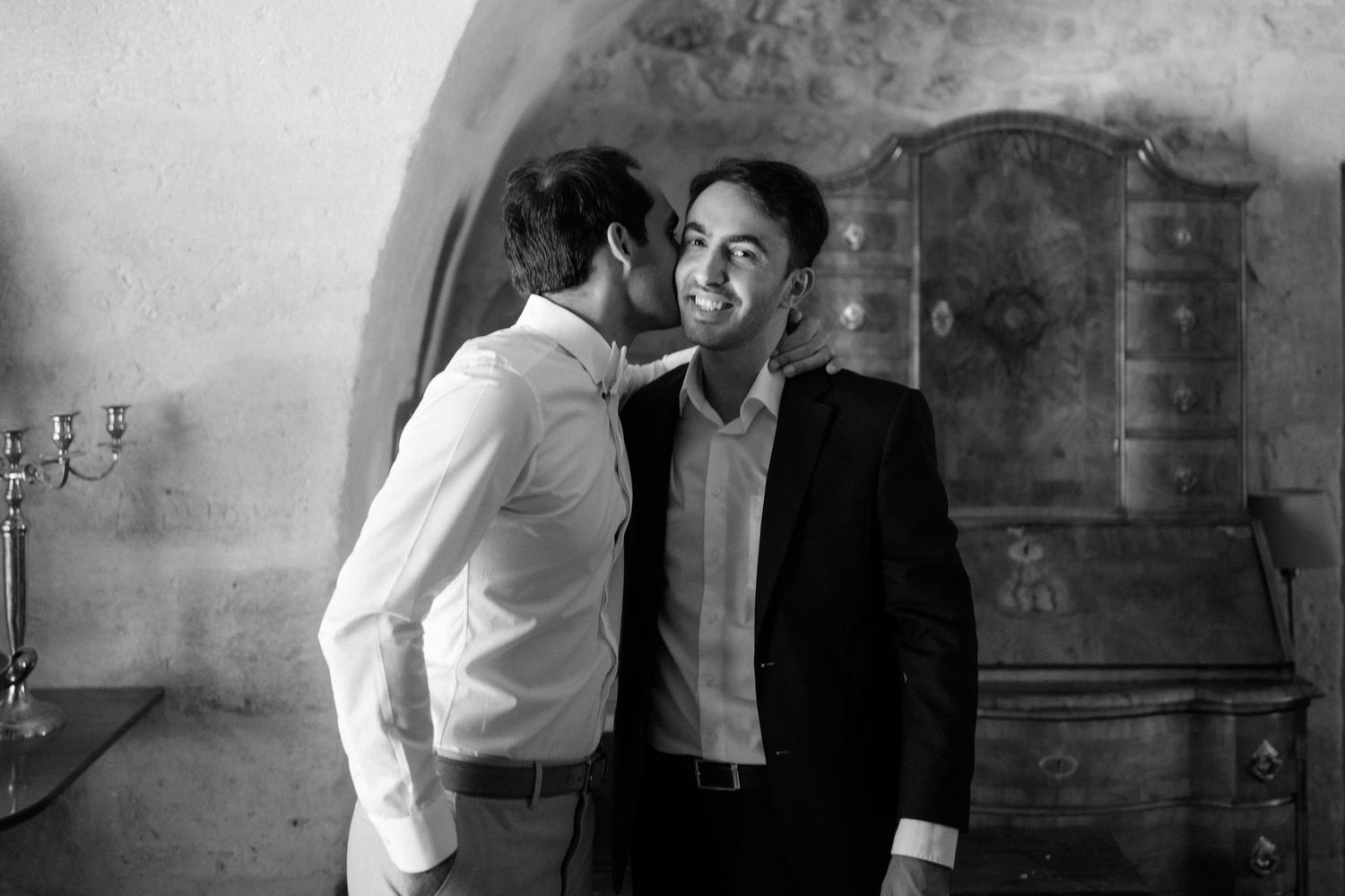 A series of intimate wedding preparation moments captured in black and white.