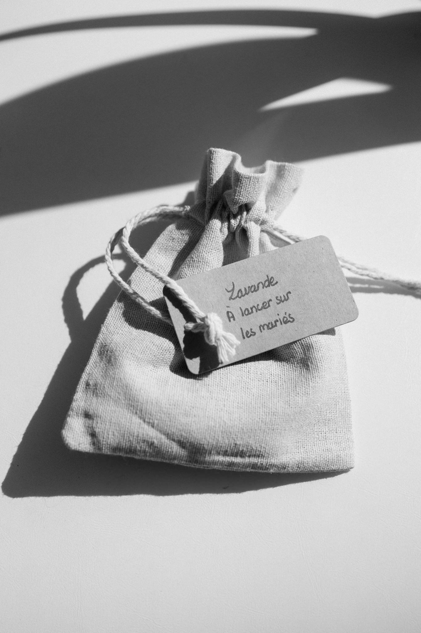 Black and white artistic photo of linen napkins with text in natural lighting.
