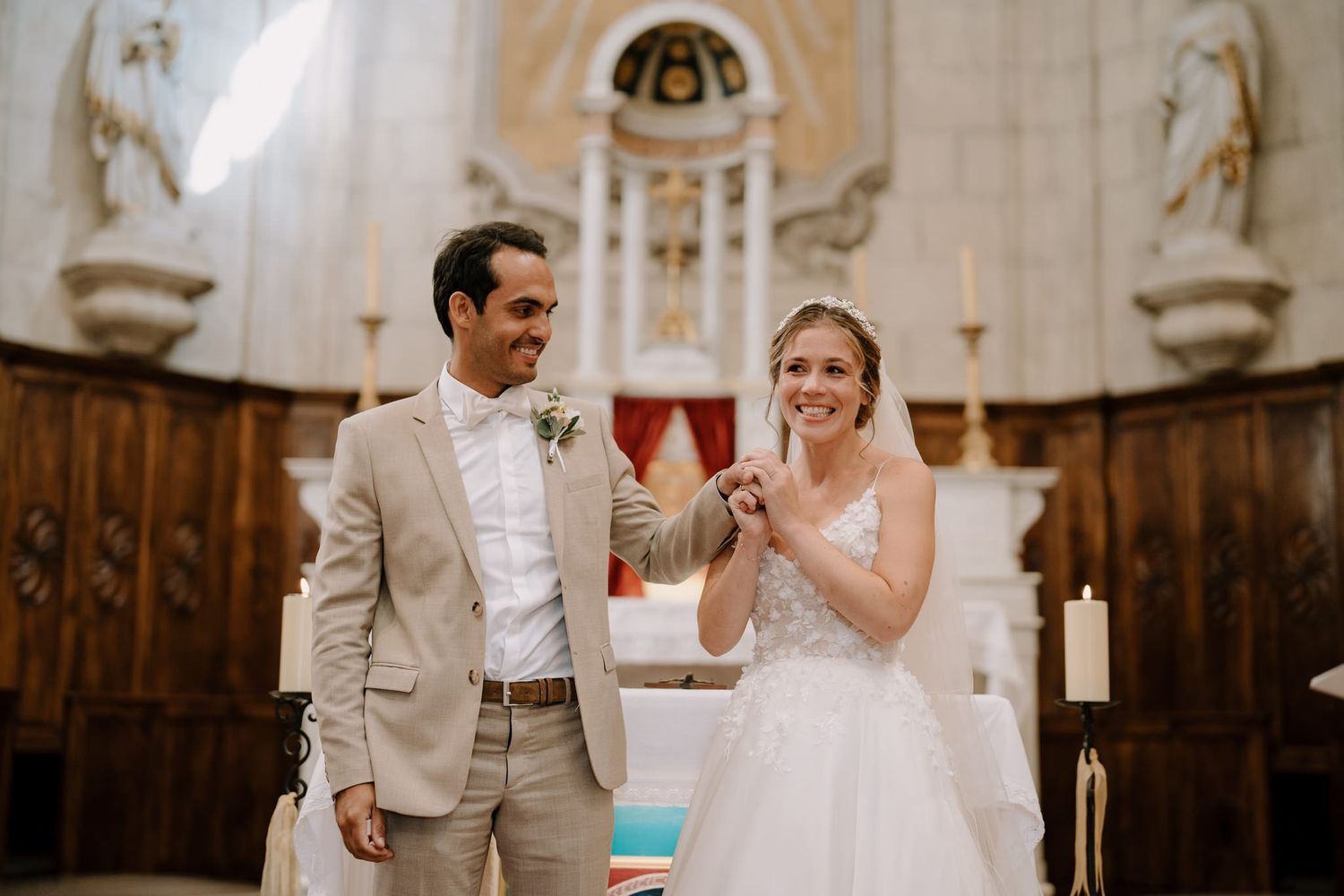 A joyful wedding celebration moment inside an elegant church with classical decor.