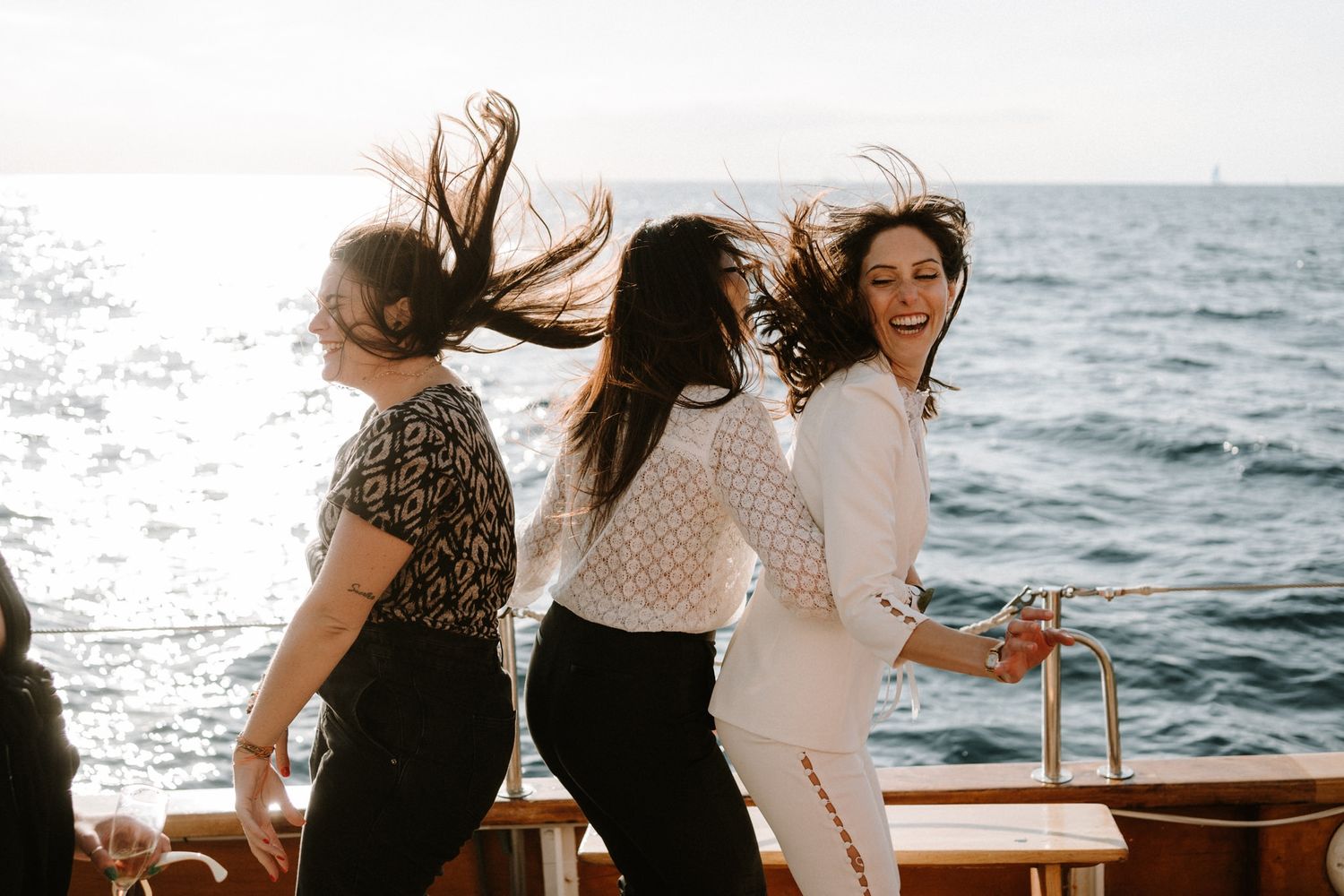 Couples enjoying a romantic boat ride along the Mediterranean coast.