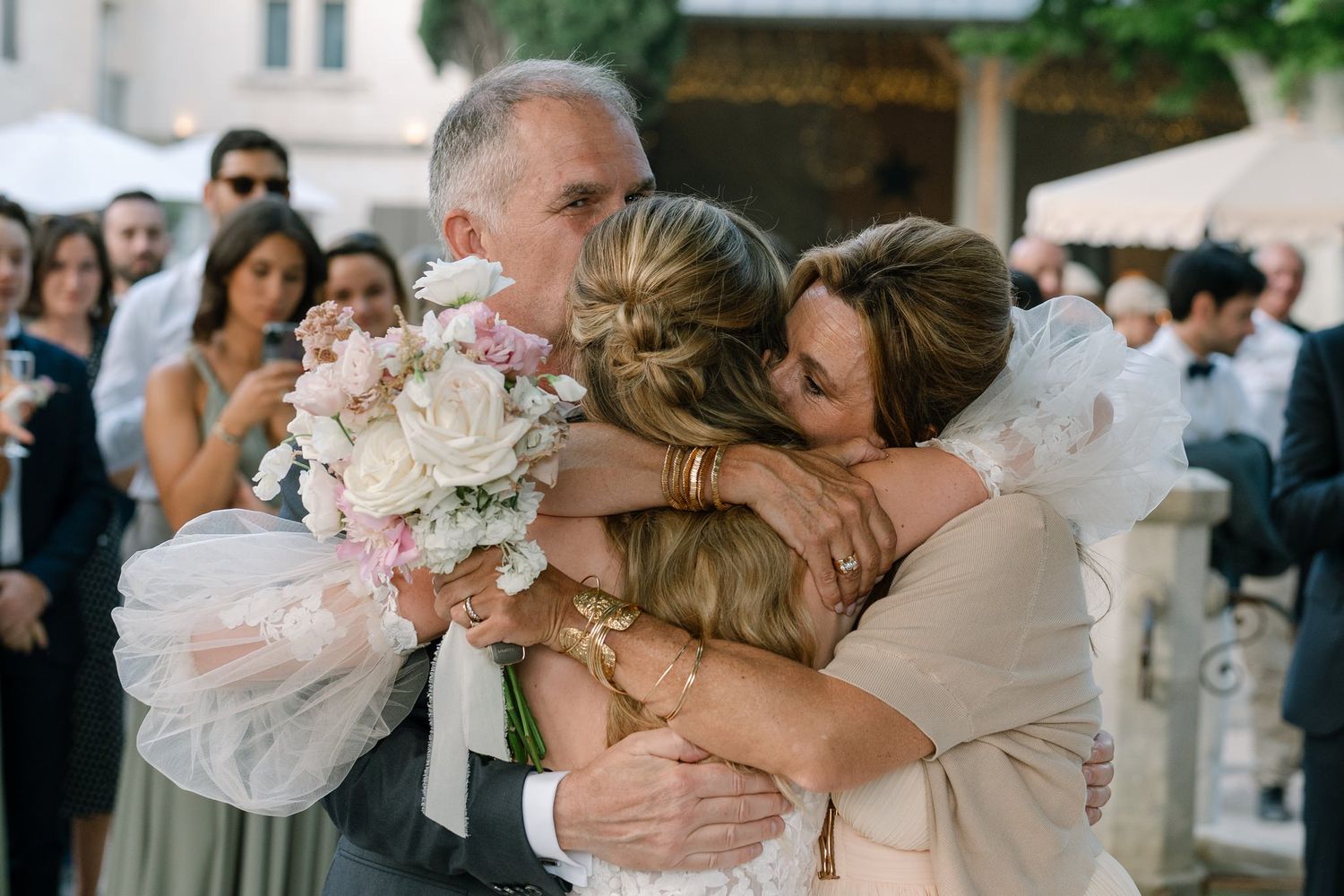 Candid wedding celebration moments captured outdoors during reception.