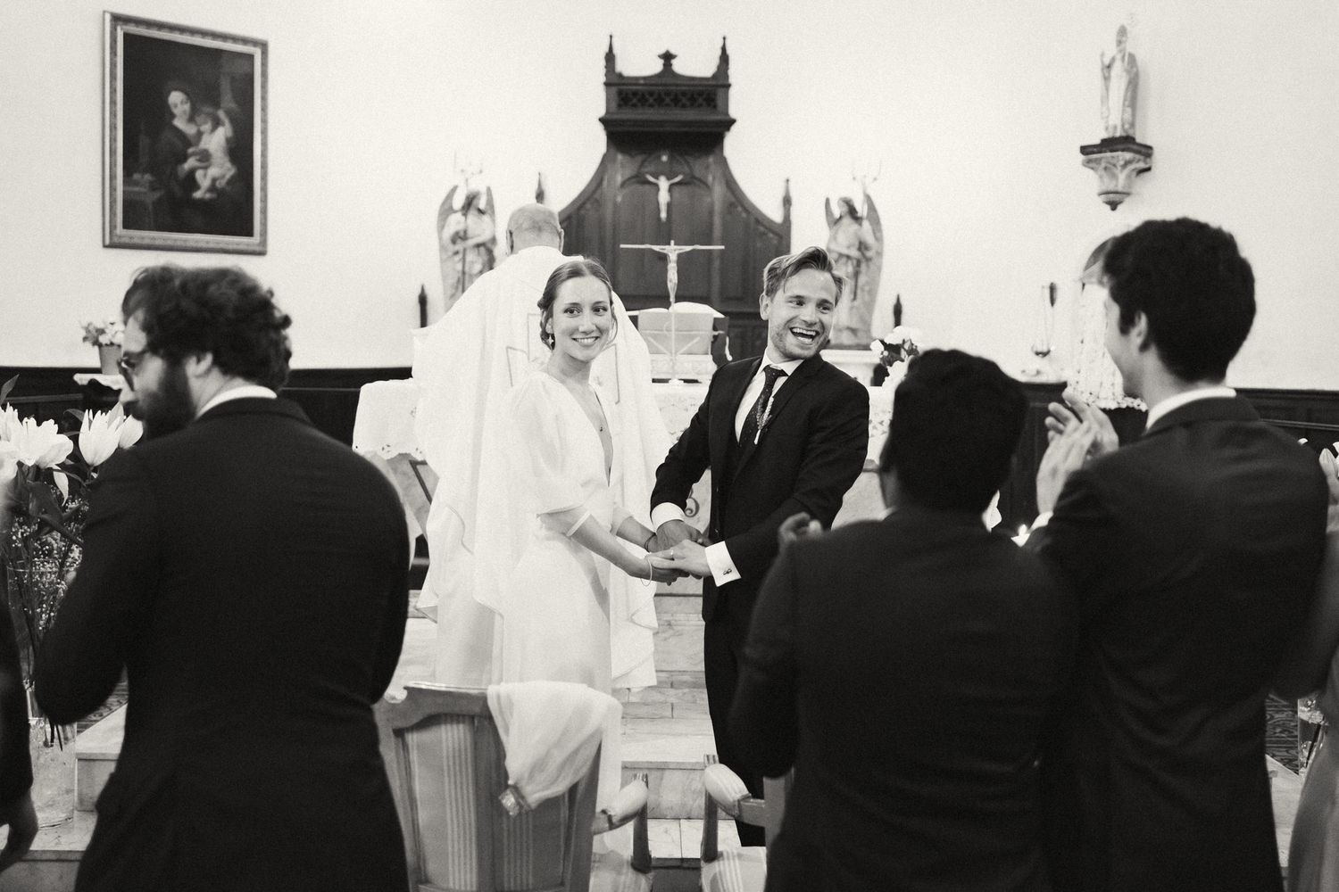 Black and white photos showing a traditional church wedding ceremony sequence.
