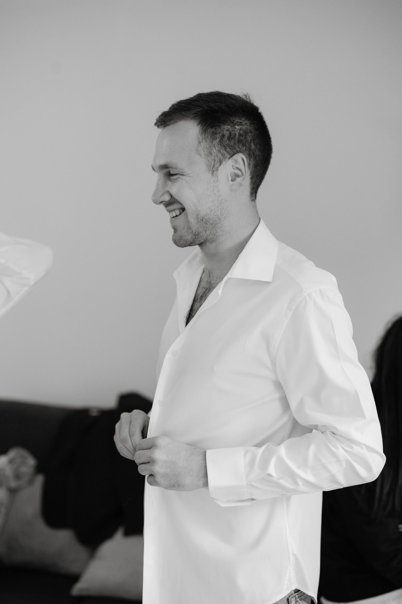 Person in white dress shirt adjusting clothing in sequence of photos.