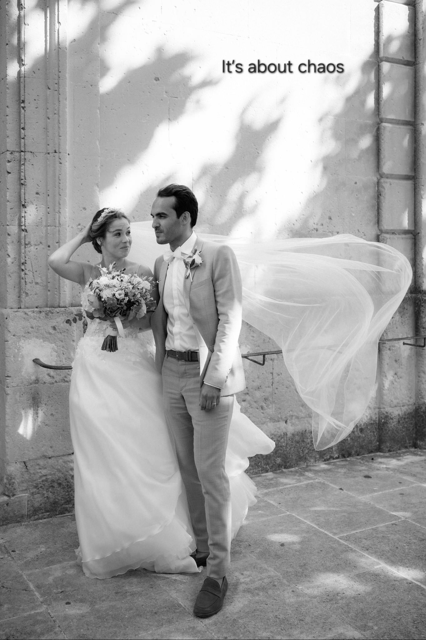 A black and white wedding photo sequence shows a couple playing with a flowing veil in the wind against a stone wall.