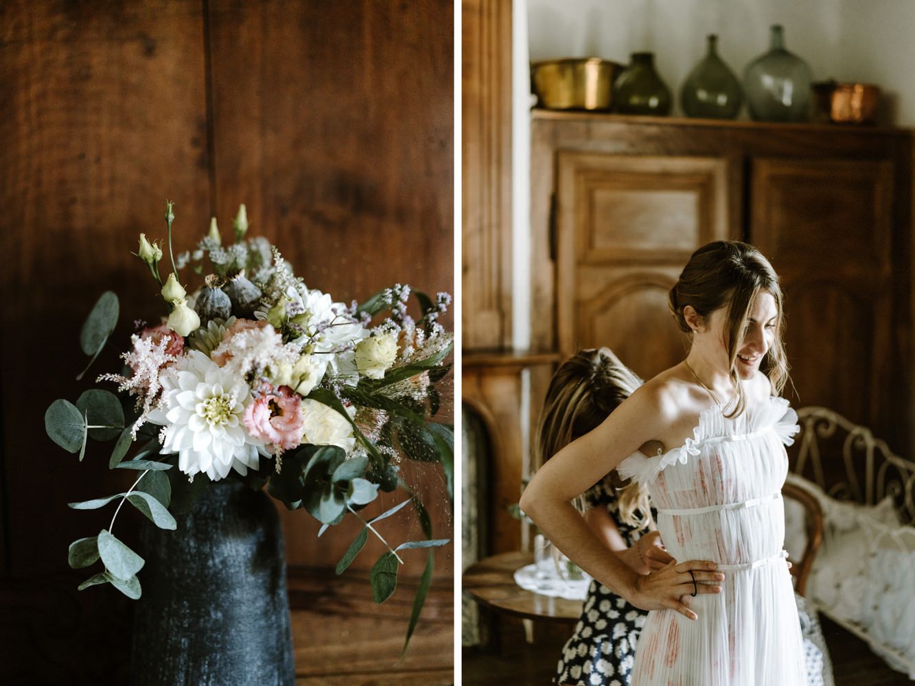 Wedding decor details with floral arrangements and vintage bottles in warm wooden setting.
