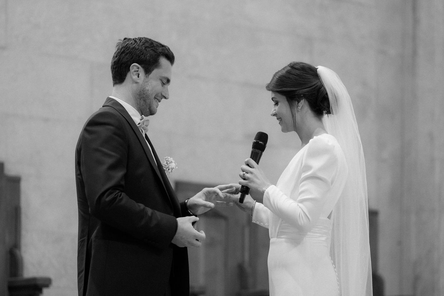 Exchange of rings during traditional church wedding ceremony.