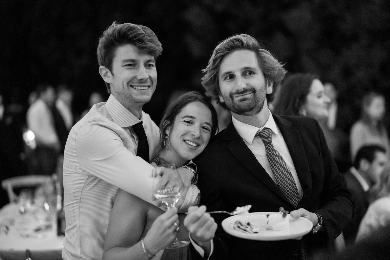 Wedding guests enjoying a candid moment at an elegant reception.