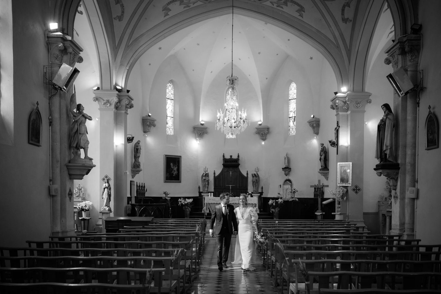 Interior views of a grand cathedral with vaulted ceilings and gothic architecture.