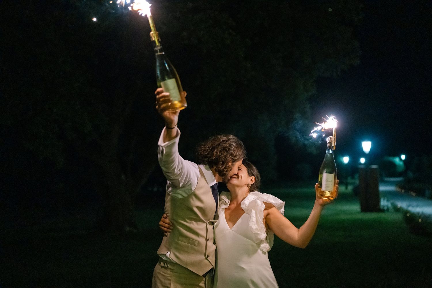 Festive nighttime celebration with sparklers and champagne.