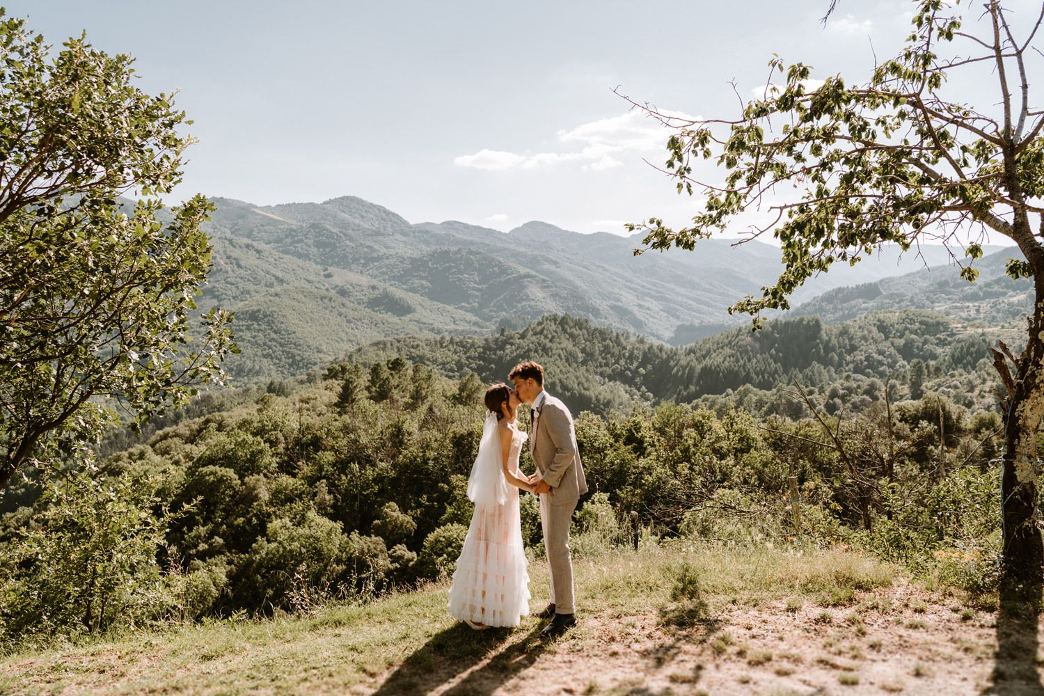 Scenic mountain landscape view with rolling hills and lush greenery.