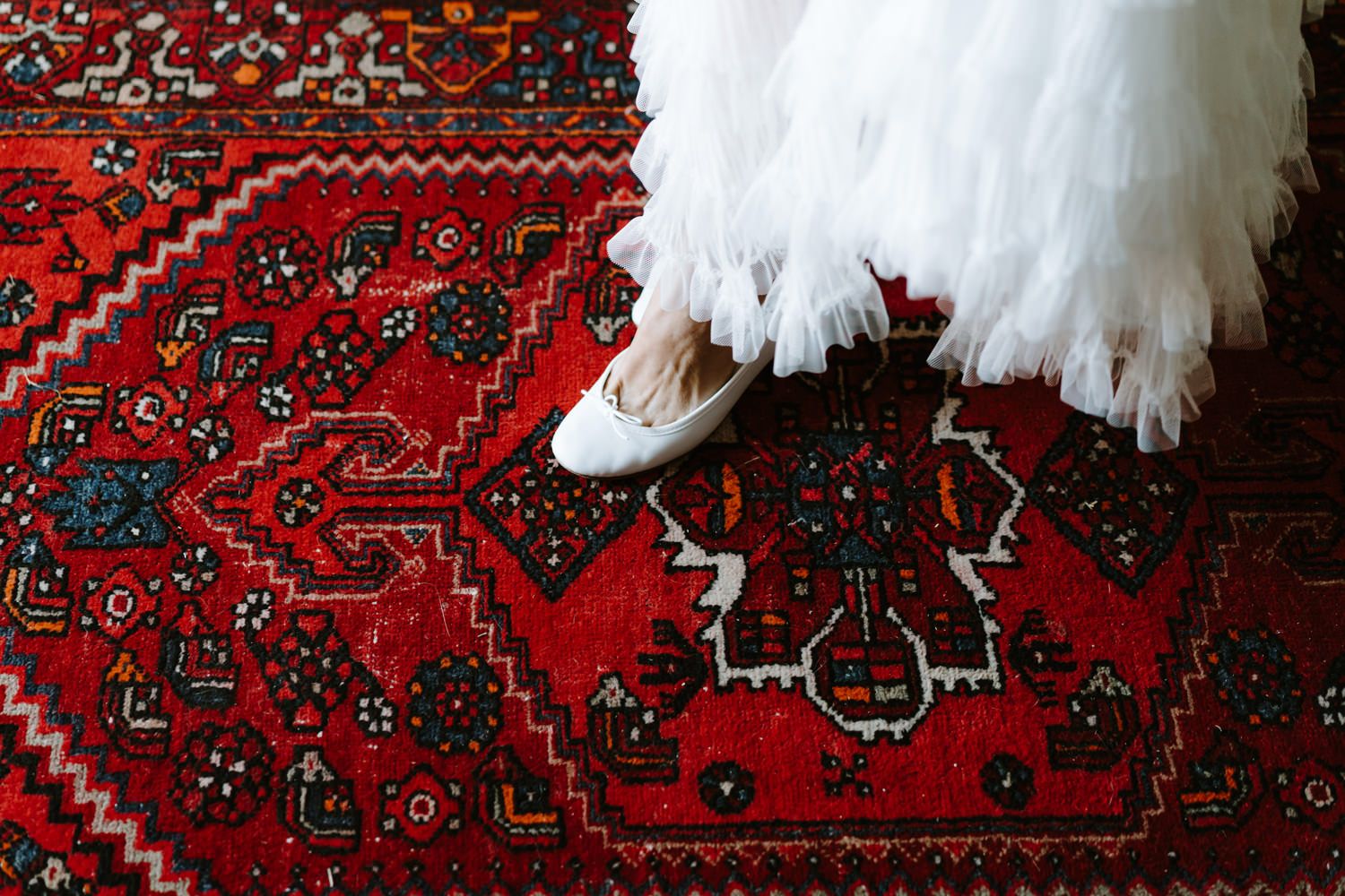 Elegant red and gold patterned oriental rugs displayed in sequence.