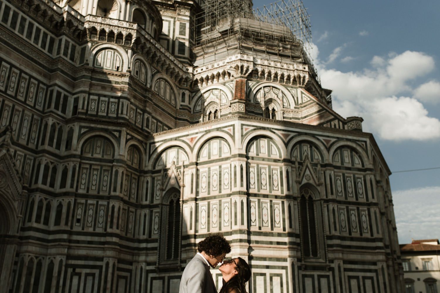Romantic moment in front of Florence's iconic Duomo cathedral.