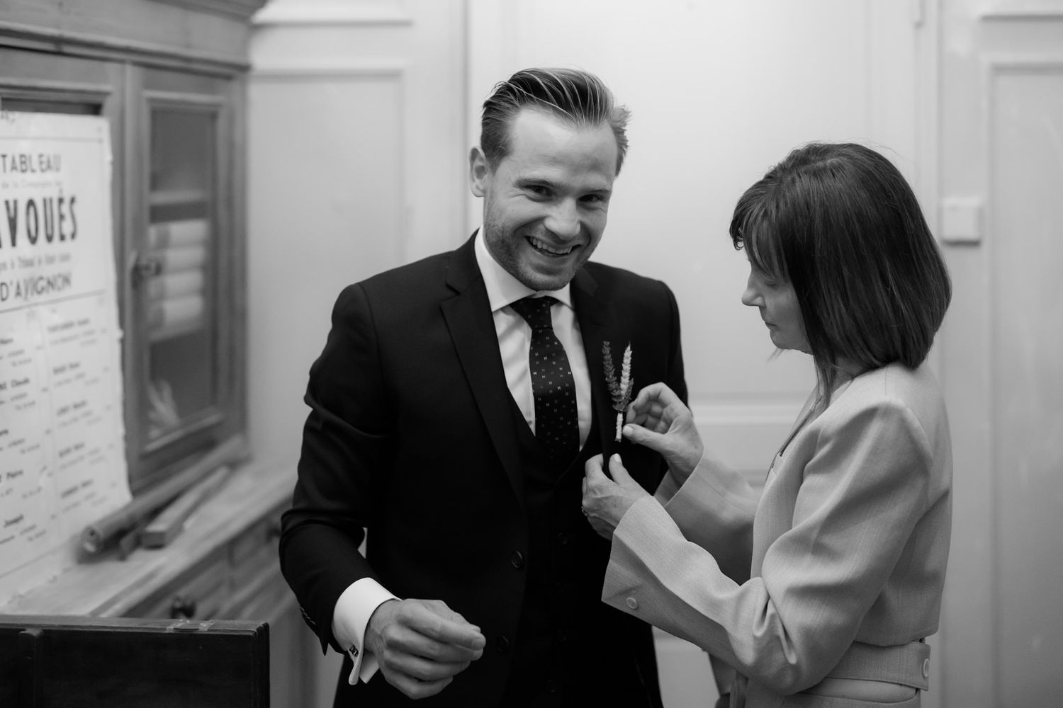 Black and white candid shots of people laughing and socializing at an event.