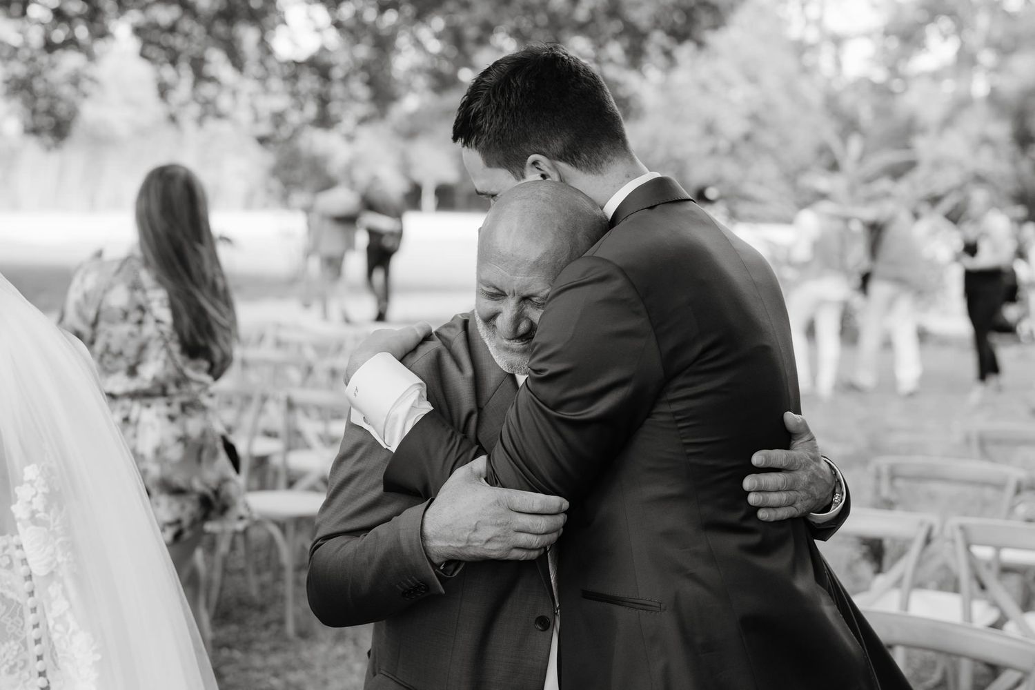 Emotional wedding celebration moments captured in black and white photography.