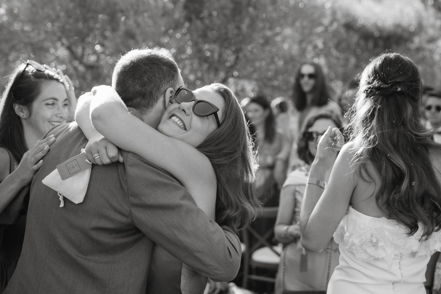 Emotional moments shared during a wedding ceremony in an olive grove.