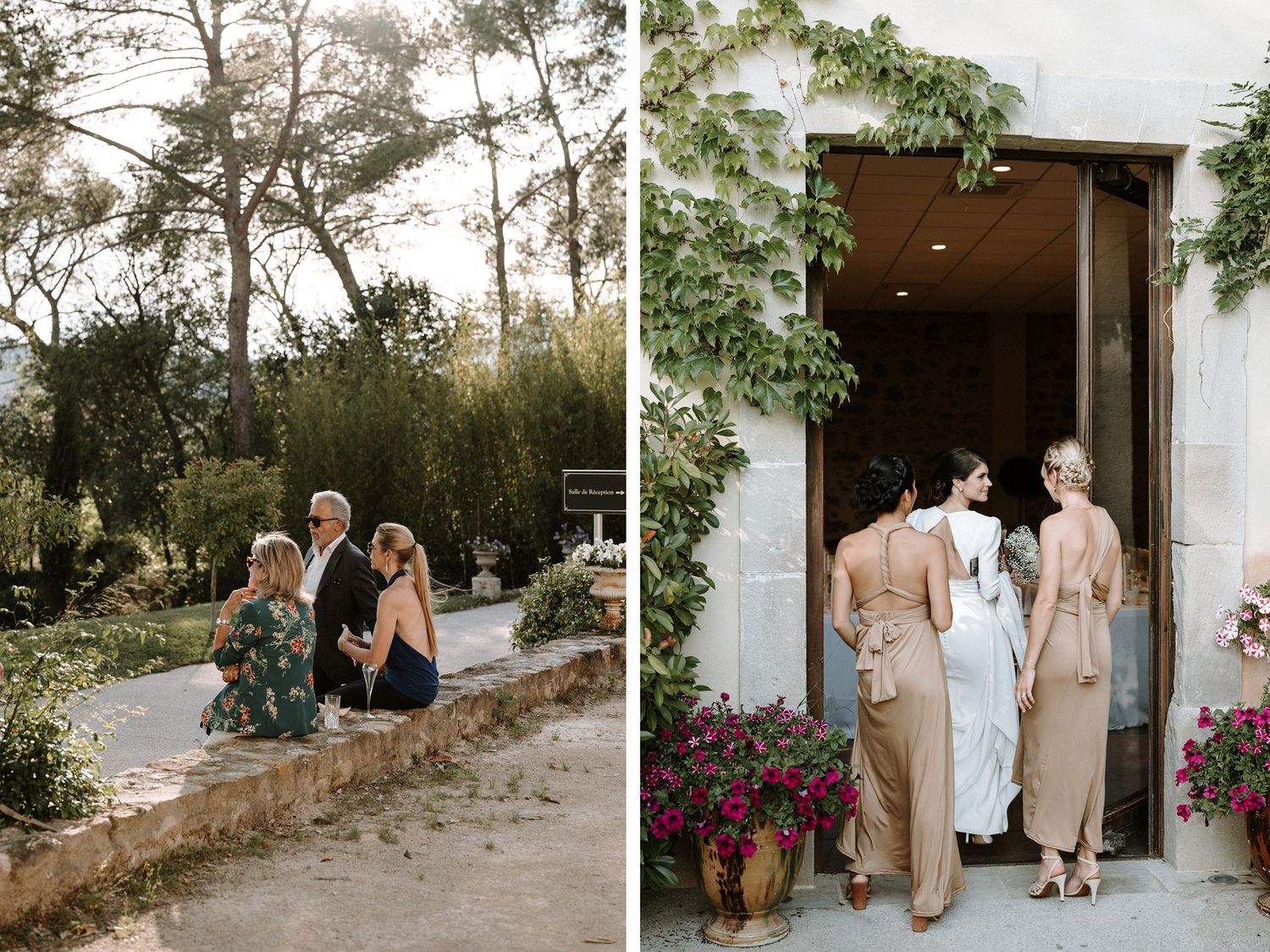 Wedding party walking along a scenic path with stone walls and flowering plants.