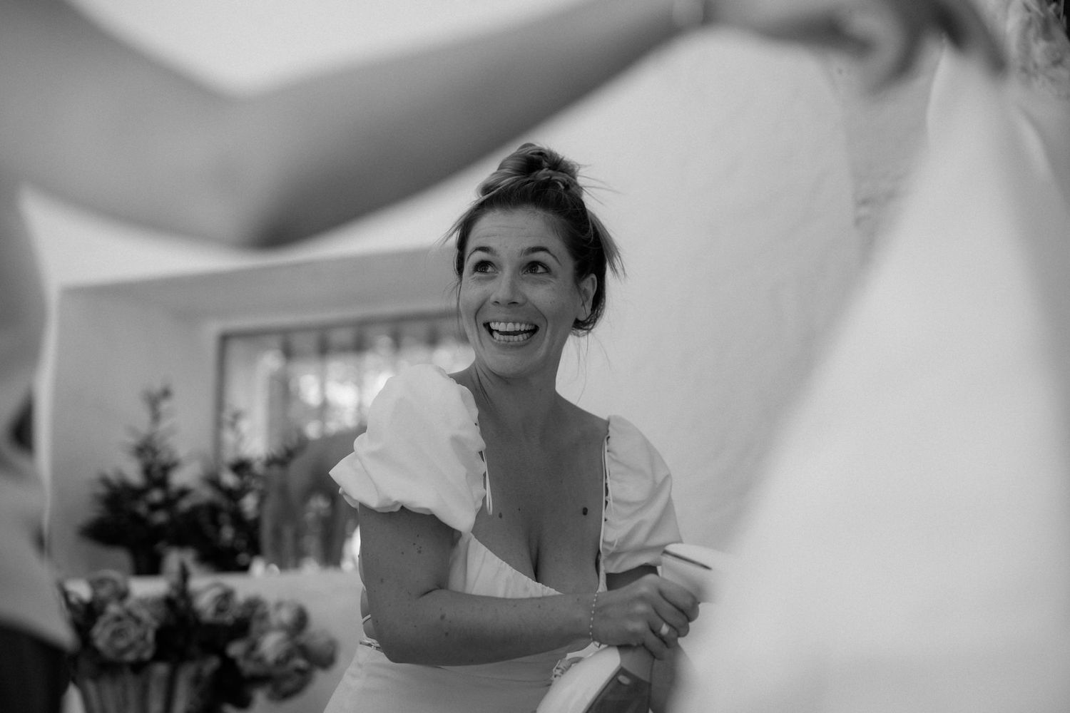 Black and white candid moments during wedding preparations.