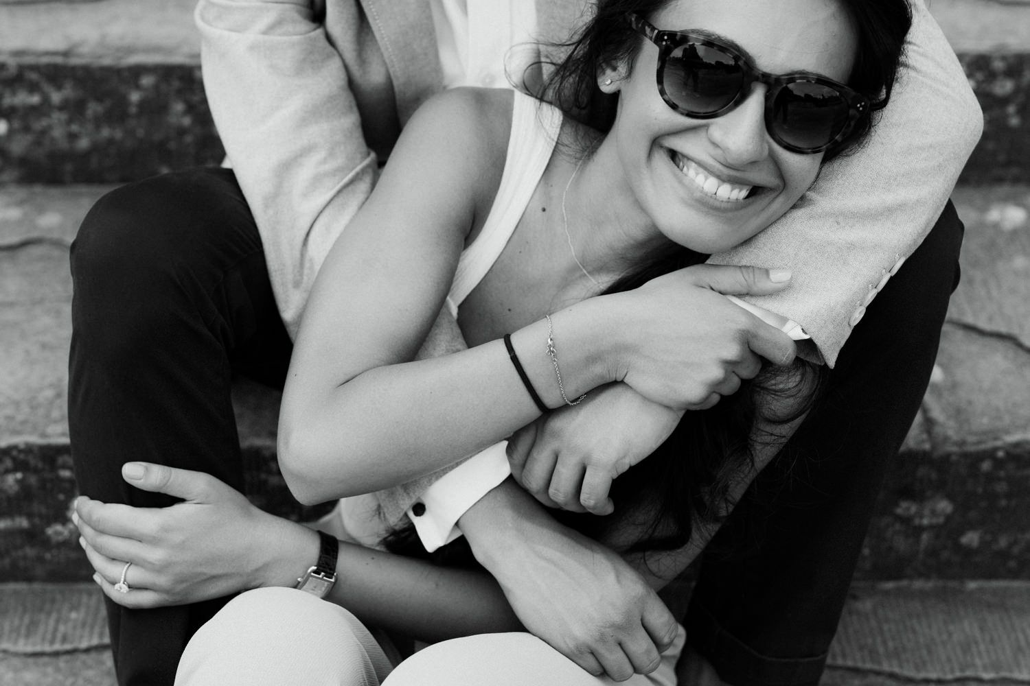 A joyful moment captured in black and white showing affection and laughter.