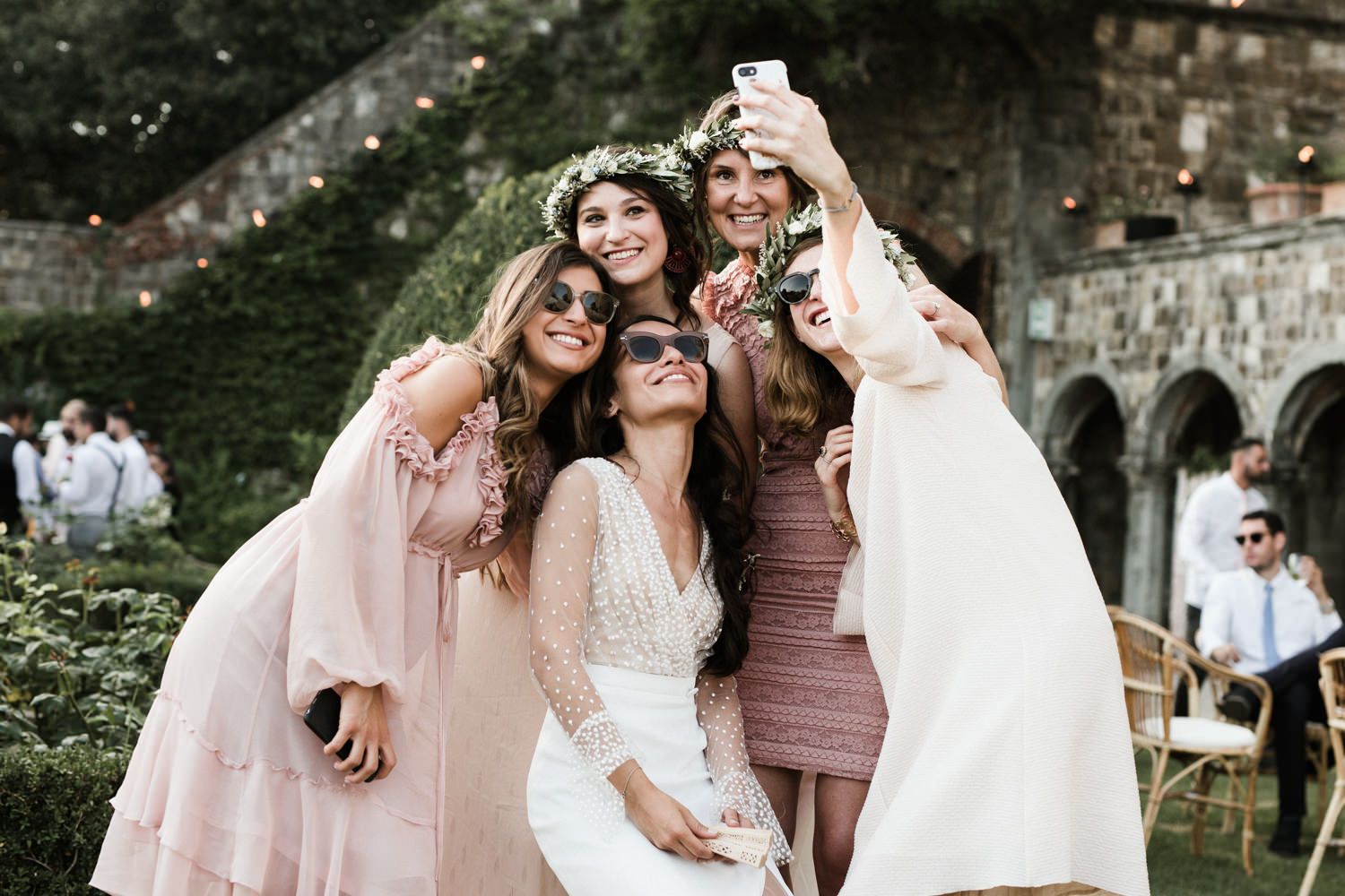 Wedding celebration candid moments captured in an outdoor garden setting.