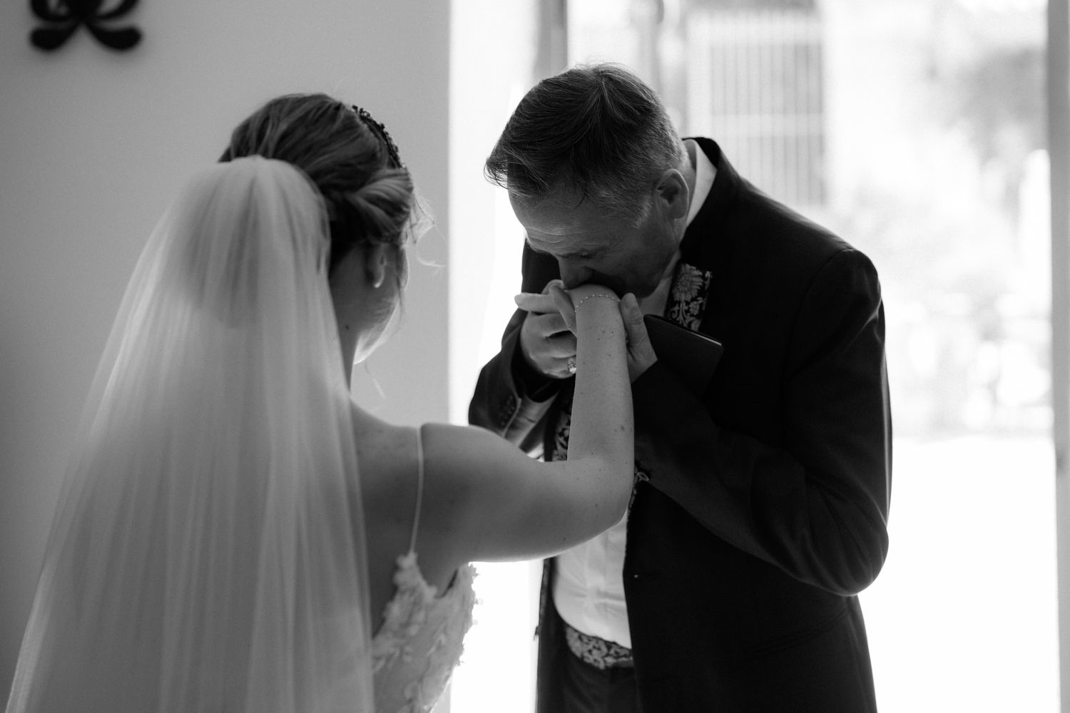 Black and white emotional moments captured during a wedding first look sequence.