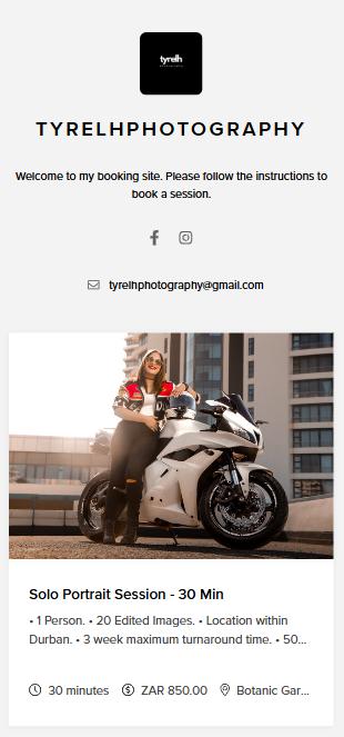 A woman in stylish attire poses confidently beside a sleek white sports motorcycle on an urban rooftop.