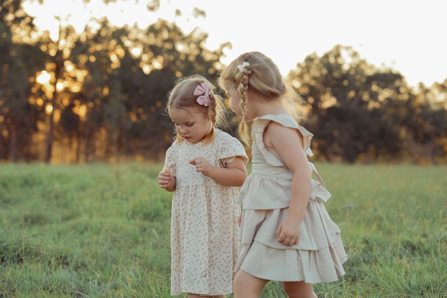 Children laughing together during a relaxed family photography session.