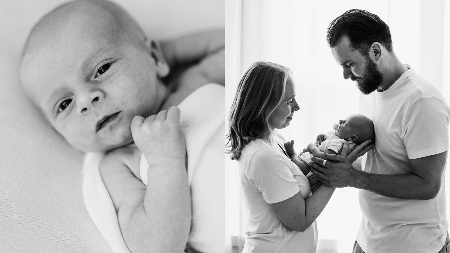 A newborn photoshoot. Baby looking at camera and parents posing in front of a window holding a newborn. Back and white photograph.