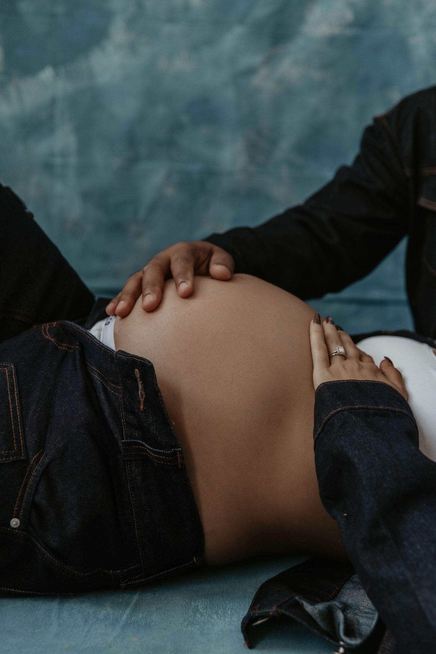 R&B inspired maternity session in Rhode Island studio featuring matching denim True to color moody maternity portrait artist Rhode Island