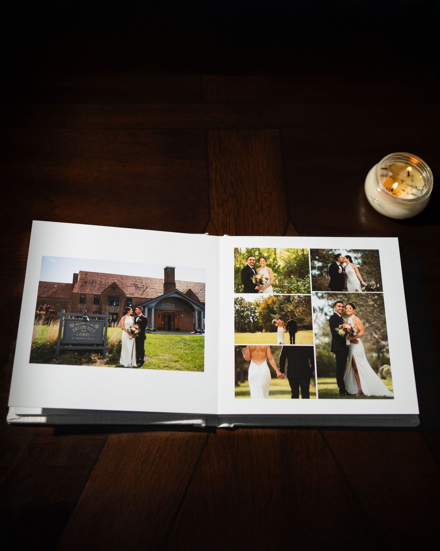 A wedding photo album lays open on a dark wooden table showing scenes from a rustic outdoor Hudson Valley brewery celebration.