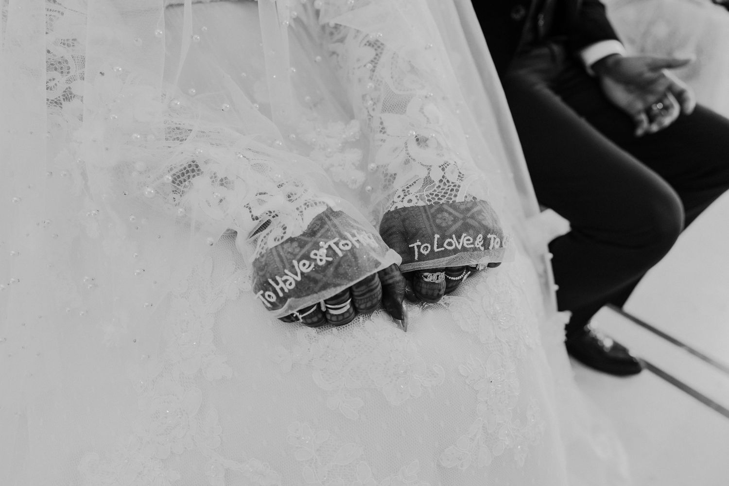 Wedding reception details with decorative elements and table settings captured in monochrome.