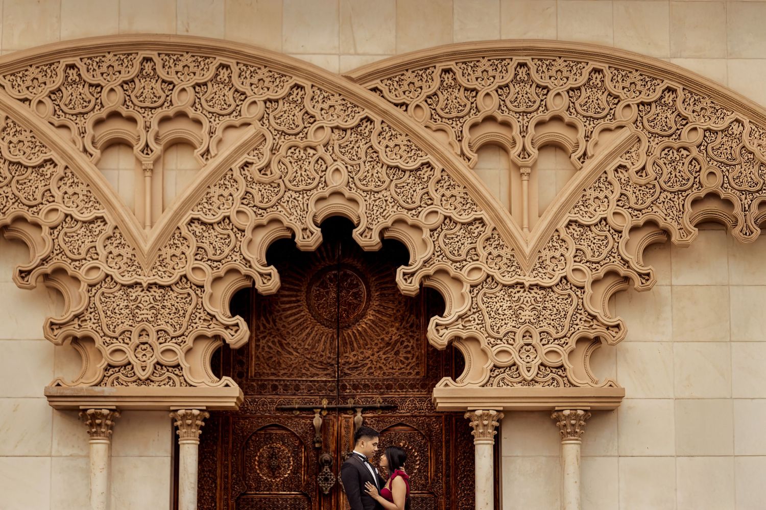 Ornate architectural details of carved stone arches and decorative elements in a historic building interior.