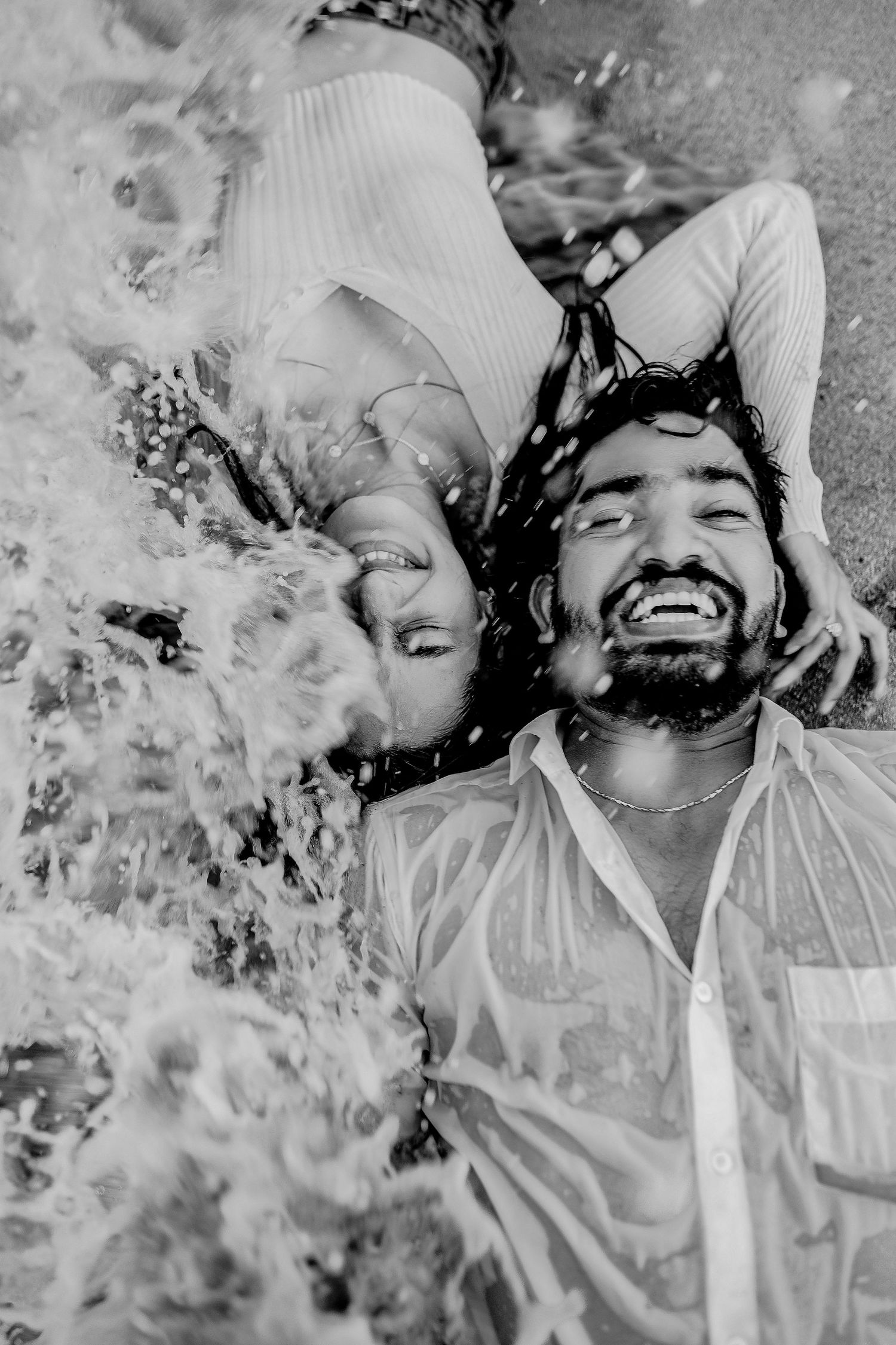 A black and white photo sequence shows a person joyfully playing in falling snow or confetti.