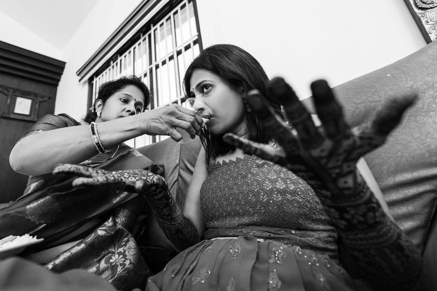 A series of black and white photographs arranged horizontally showing people dancing and moving in an artistic performance.